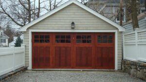 Wood garage door with four window panels on detached garage